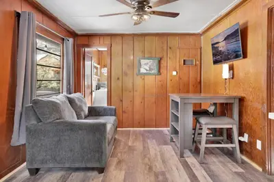 a living room with a couch and a table at Sunset #101 in Big Bear Lake