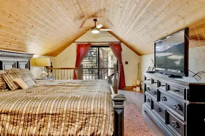 a bedroom with a bed and a flat screen tv at How sweet it is #1531 in Big Bear Lake