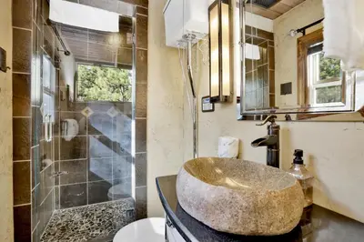 a bathroom with a bowl sink and a shower at How sweet it is #1531 in Big Bear Lake