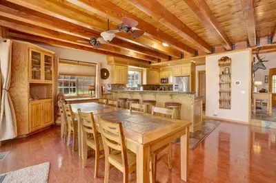 a kitchen with a large wooden table and chairs at Lakefront village castle #2312 in Big Bear Lake