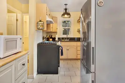 a kitchen with a refrigerator and a microwave at Beary cozy cabin #2315 in Big Bear Lake