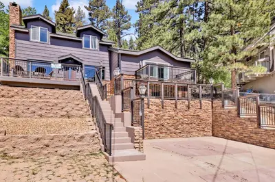 a brick house with a staircase in front of it at Circle views #1602 in Big Bear Lake