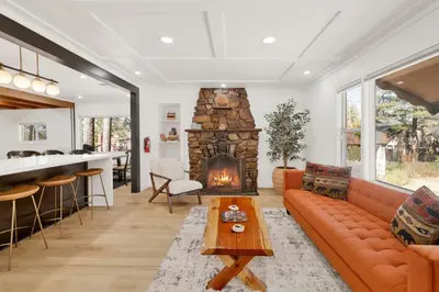 a living room with a couch and a fireplace at Vista pines #234 in Big Bear Lake