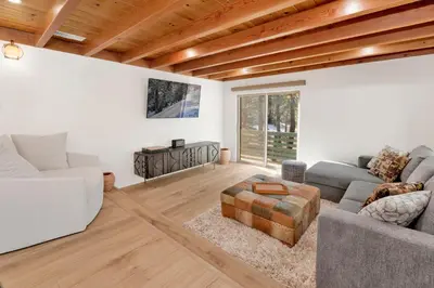a living room with a couch and a table at Vista pines #234 in Big Bear Lake