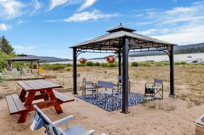 a picnic table and chairs under a gazebo at North shore chalet #2173 in Fawnskin