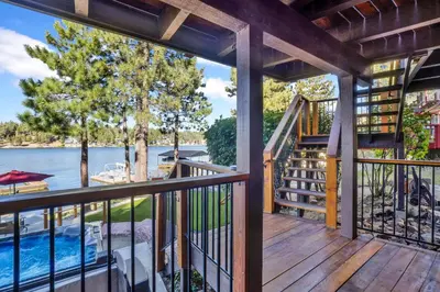 a deck with a view of the water at Cove lakefront chalet #2098 in Big Bear Lake