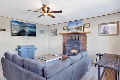 a living room with a couch and a fireplace at Shore acres lodge #450 in Big Bear Lake