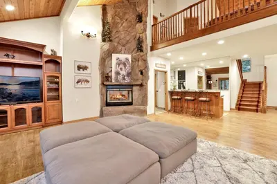 a living room with a couch and a fireplace at The spa at winterset #2282 in Big Bear Lake