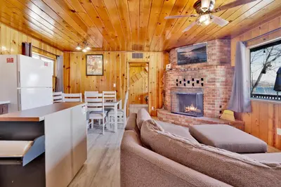 a living room with a couch and a fireplace at Sunrise #108 in Big Bear Lake