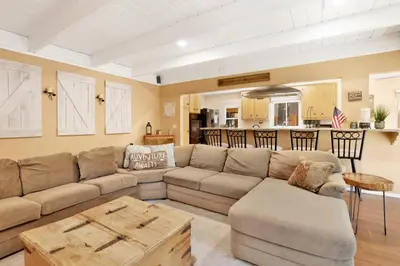 a living room with a couch and a table at Cozy up to summit #1651 in Big Bear Lake