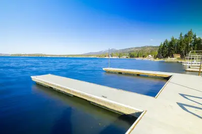 a dock in the middle of a large body of water at Juniper #105 in Big Bear Lake