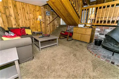 a living room with a couch and a fireplace at Grandpas axe # 1775 in Big Bear Lake