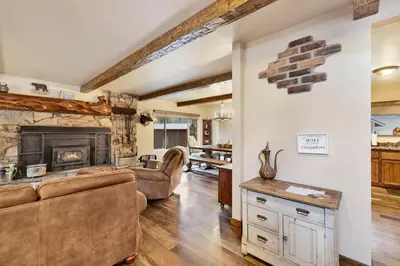a living room with a couch and a fireplace at Eagle point lodge #2080 in Big Bear Lake