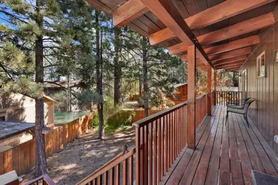a wooden deck with a bench on it at Eagle point lodge #2080 in Big Bear Lake