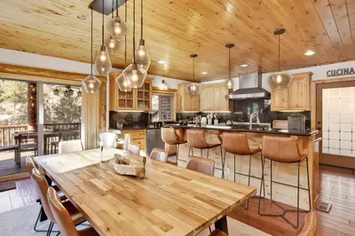 a large kitchen with a wooden table and chairs at Gold rush lodge #2352 in Big Bear Lake