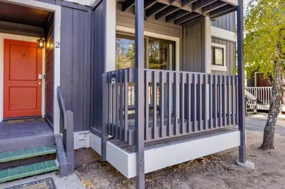 a house with a orange door and a porch at Blue jay getaway #2082 in Big Bear Lake