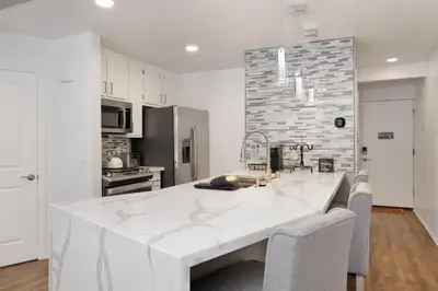 a white kitchen with a large white counter top at Blue jay getaway #2082 in Big Bear Lake