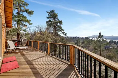 a deck with a view of the mountains at Starlight vistas #1524 in Big Bear Lake