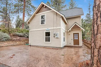 a small white house with a driveway at Mount berkley #2367 in Big Bear Lake