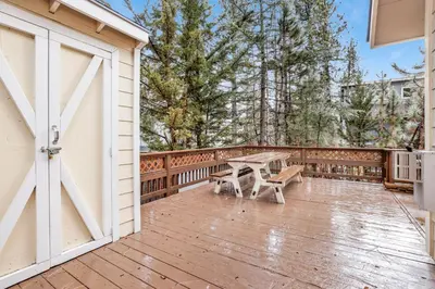 a wooden deck with a picnic table on it at Mount berkley #2367 in Big Bear Lake