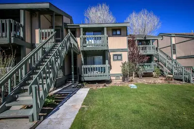 a large building with stairs in a yard at Boulder creek #1417 in Big Bear Lake
