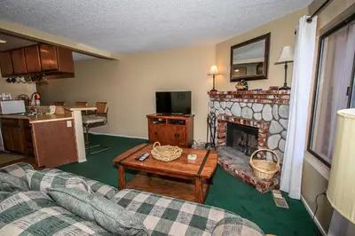 a living room with a couch and a fireplace at Boulder creek #1417 in Big Bear Lake