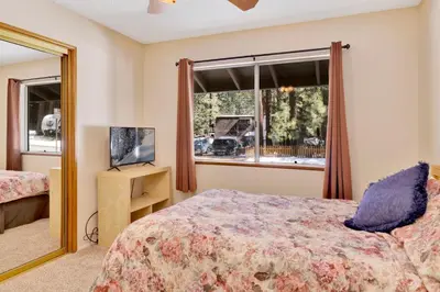 a bedroom with a bed and a window at Crestwood summit #2119 in Big Bear Lake
