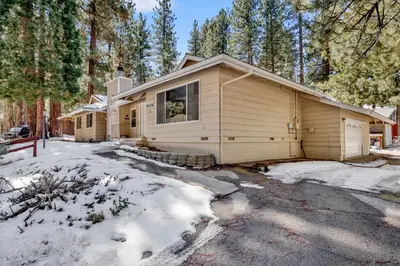 a house in the woods in the snow at Crestwood summit #2119 in Big Bear Lake