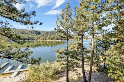 a view of a lake through the trees at Fishermans paradise #1792 in Big Bear Lake