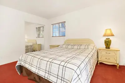 a bedroom with a bed and a lamp on a night stand at Cozy summit #2222 in Big Bear Lake