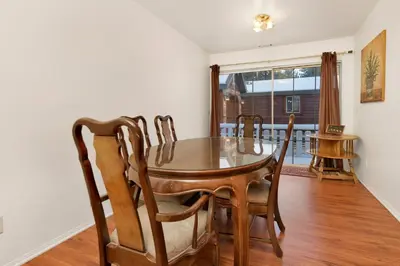 a dining room with a wooden table and chairs at Cozy summit #2222 in Big Bear Lake