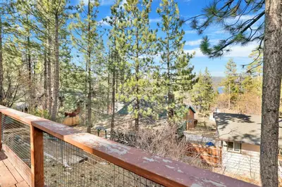 a view from the deck of a cabin in the woods at Temple Lake Views#2298 in Big Bear Lake