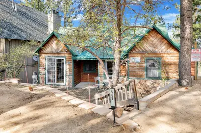 a log cabin with a sign in front of it at Temple Lake Views#2298 in Big Bear Lake