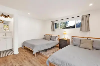 a bedroom with two beds and a window at Conklin paradise #1993 in Big Bear Lake