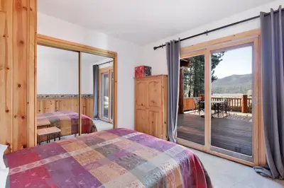 a bedroom with two beds and a balcony at The alps lodge #2142 in Big Bear Lake