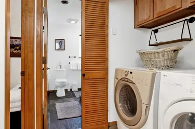 a laundry room with a washer and dryer in it at Chimney Peak Chalet#2048 in Big Bear City