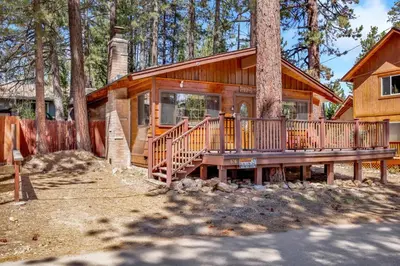 a log home with a large deck in the woods at Casa catalina #667 in Big Bear Lake