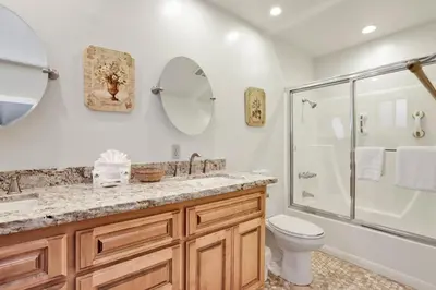 a bathroom with a shower and a toilet and a sink at A hidden asset #2379 in Big Bear Lake