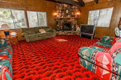 a living room with a couch and a television at MAKIN' MEMORIES AT SUMMIT #1683 in Big Bear Lake