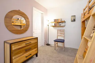 a room with a dresser and a mirror and a chair at BROWNIE'S DEN #2205 in Big Bear Lake