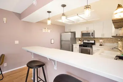 a kitchen with a large white counter top and appliances at BROWNIE'S DEN #2205 in Big Bear Lake
