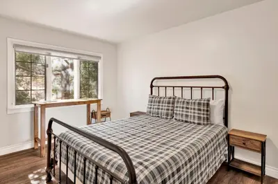 a bedroom with a bed and two windows at Splash mountain #1904 in Big Bear Lake