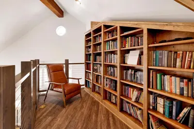 a room with book shelves filled with books at Splash mountain #1904 in Big Bear Lake