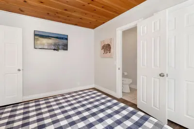 a bathroom with white walls and a wooden ceiling at Splash mountain #1904 in Big Bear Lake