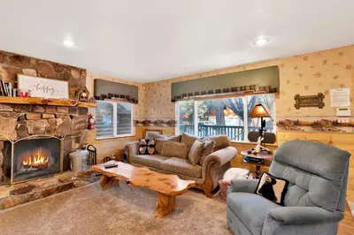 a living room with a couch and a fireplace at Big bear happy place #2421 in Big Bear Lake