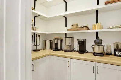 a kitchen with white cabinets and appliances on a counter at Pine meadow village castle #2301 in Big Bear Lake