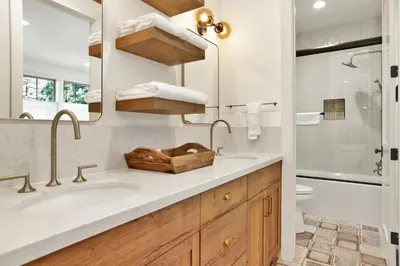 a bathroom with a sink and a toilet and a mirror at Pine meadow village castle #2301 in Big Bear Lake