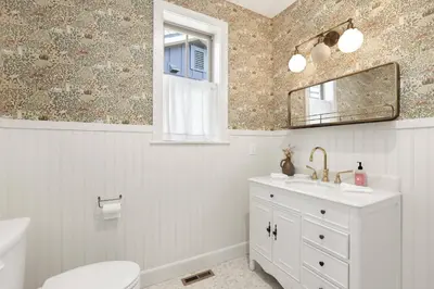 a bathroom with a sink and a toilet and a mirror at Pine meadow village castle #2301 in Big Bear Lake
