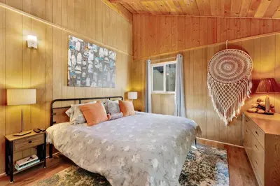 a bedroom with a large bed and a window at Marin getaway #2013 in Big Bear Lake