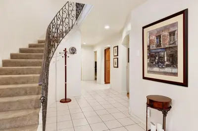 a staircase in a home with a picture on the wall at Mockingbird getaway #2091 in Big Bear Lake